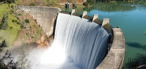 Water spills over the top of Englebright Dam on the Yuba River