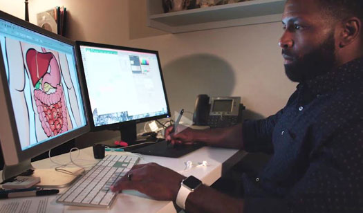 Graphic artist working on an educational manual