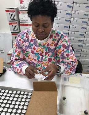 Woman filling a science kit