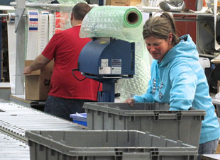 Woman working at our Rock Creek distribution center