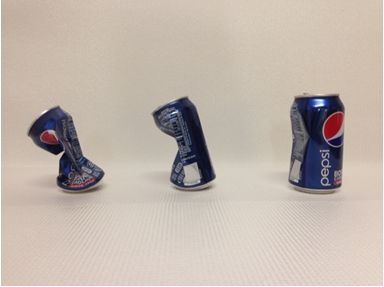 Figure 1 Imploded cans with interior water from left to right at 100° C, 90° C, and 80° C.